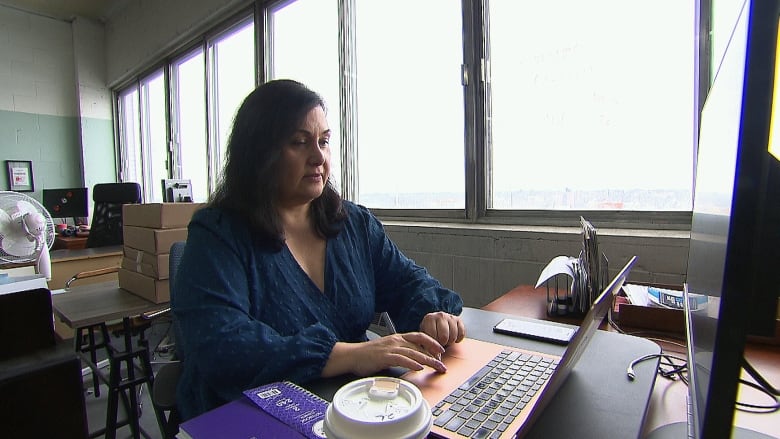 woman sitting at computer