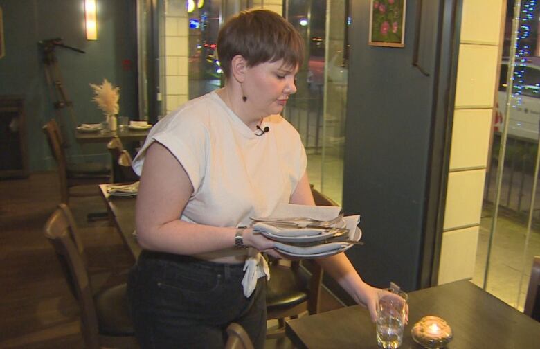 Server Jeanine Fahlman sets a table at Folke restaurant in Vancouver.