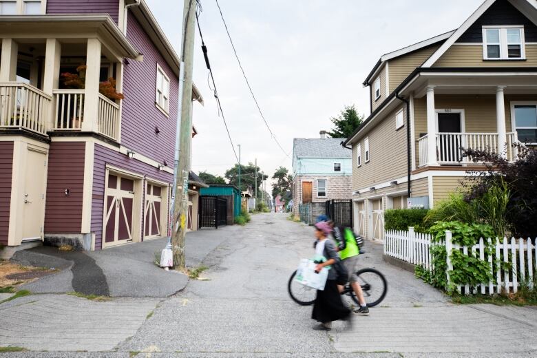 An alleyway with colorful houses is pictured. 