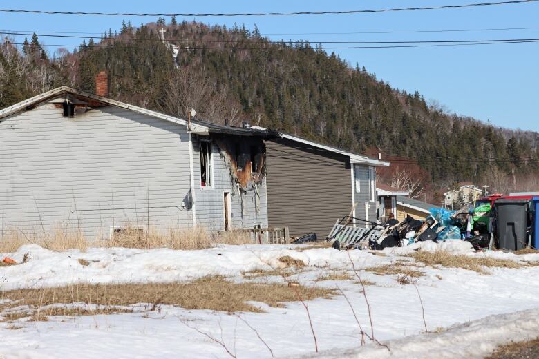 A burned house in relation to the homicide arrest in Eskasoni.