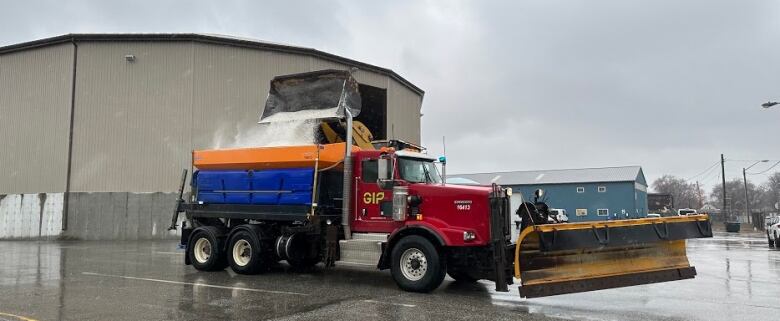 A truck being loaded with salt.