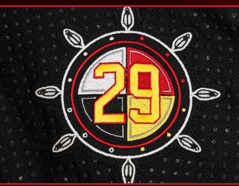 A Gino Odjick tribute shoulder patch on the Vancouver Canucks' First Nations Night jersey.