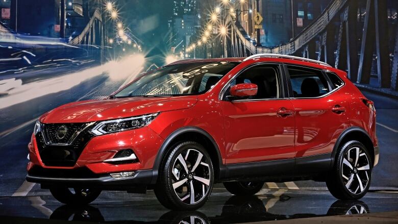 A red Nissan Rogue Sport of the 2020 model year is shown