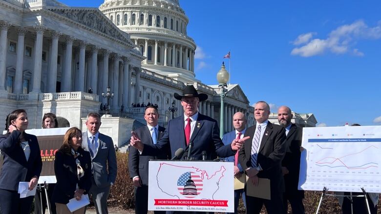 Lawmakers speak at podium outside U.S. Capitol. 