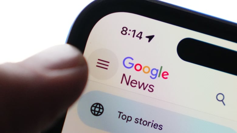 A Google News logo on the corner of a smartphone screen.