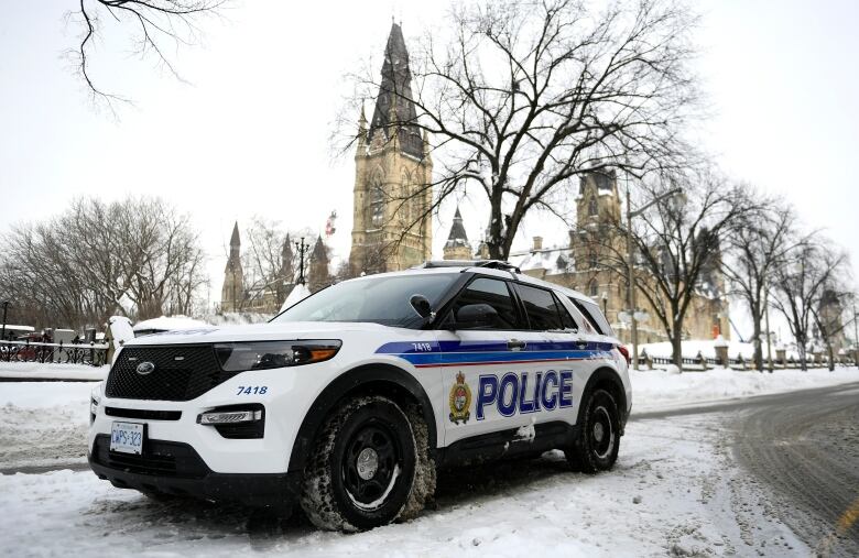 A police cruiser on a snow covered road near Parliament Hill in Ottawa.