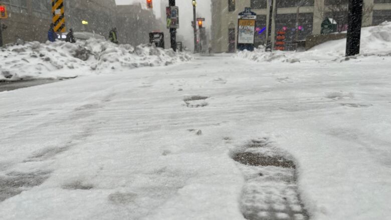 A footprint in the snow.