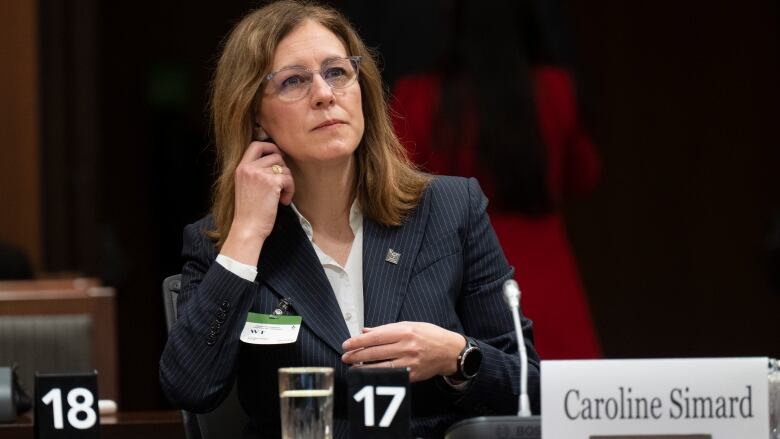 Commissioner of Canada Elections Caroline Simard waits to appear before the Standing Committee on Procedure and House Affairs on Parliament Hill on March 2, 2023 in Ottawa.