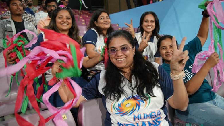 Fans of the newly-formed Mumbai Indians women's team packed DY Patil stadium to watch the first match of the inaugural Women's Premier League, a new professional cricket league in India. 