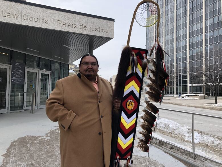 Dylan Courchene, councilor of Sagkeeng First Nation, brought a eagle staff into the courtroom, to show support for Victoria McIntosh. 