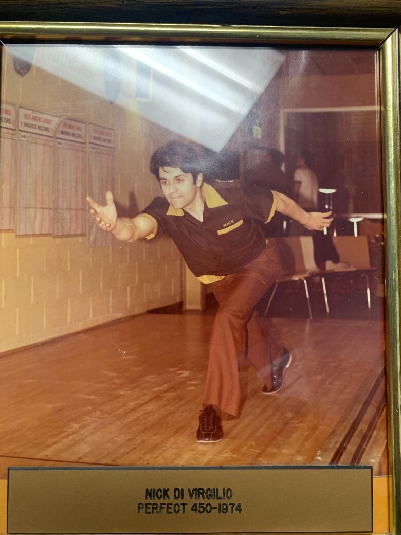 An old photo with a man bowling on it reads 