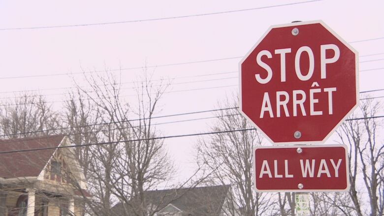 A bilingual stop sign