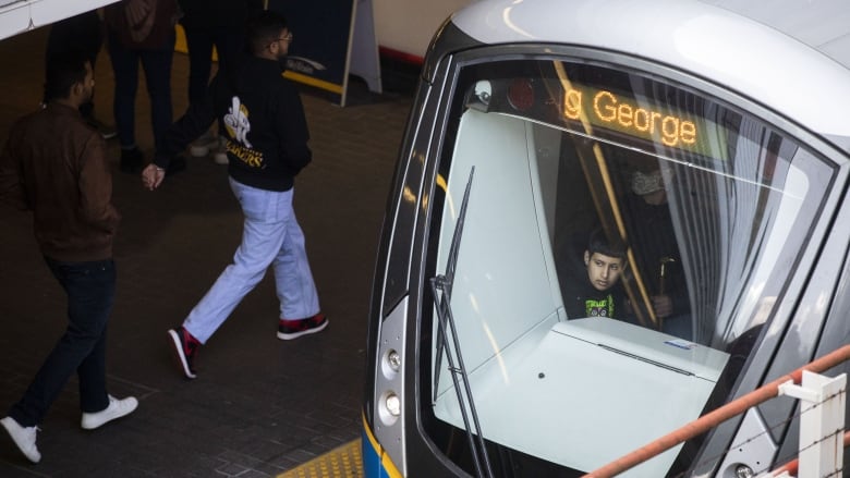 People ride the SkyTrain in Vancouver, British Columbia on Wednesday, March 15, 2023. 