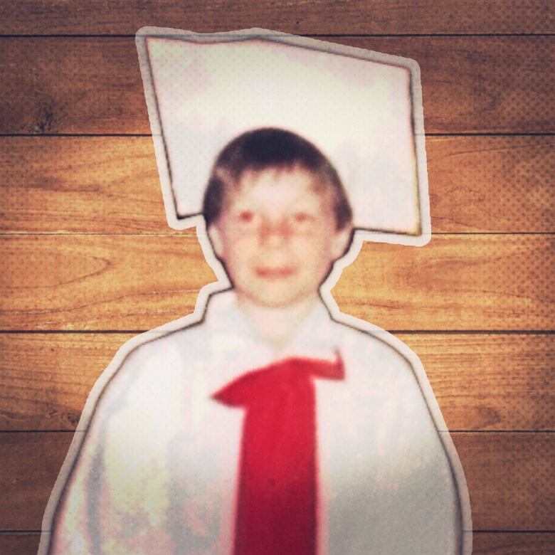 Childhood photo of Shane Flahr at a school graudation