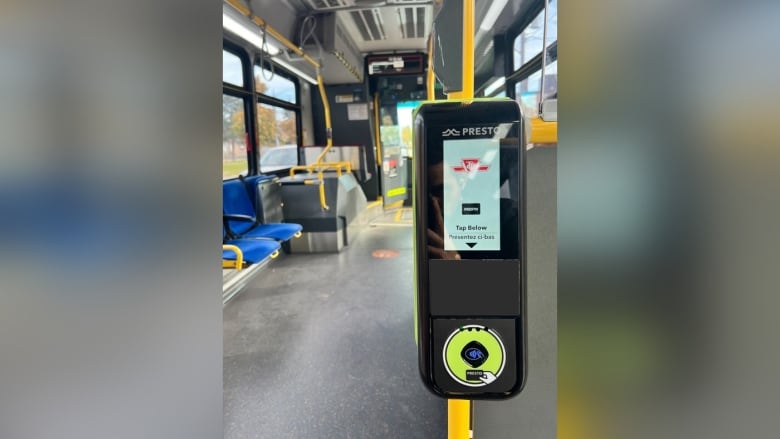 A digital fare payment machine on a Toronto city bus.