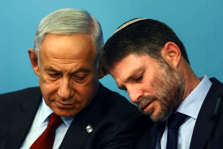 Israeli Prime Minister Benjamin Netanyahu and Israeli Finance Minister Bezalel Smotrich hold a news conference in Jerusalem, Wednesday, Jan. 25, 2023.