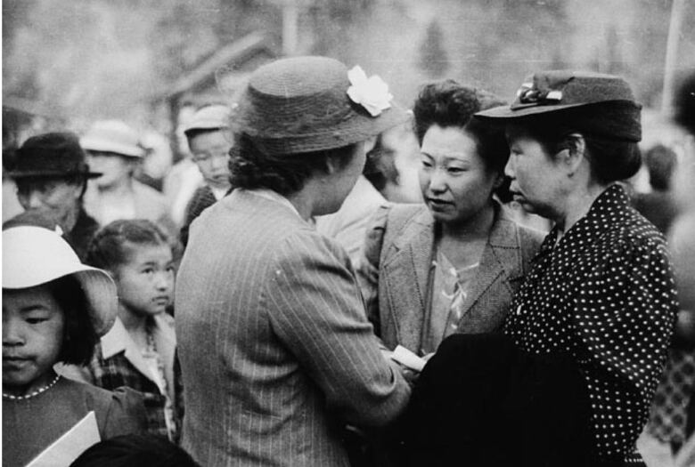 Women and girls gather together.