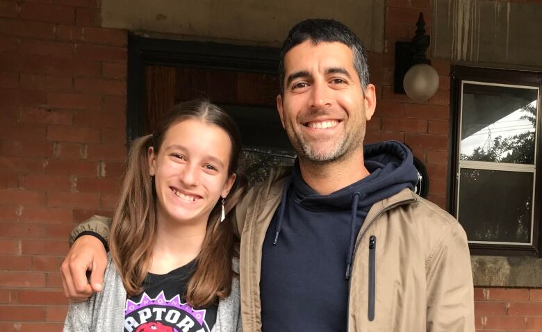 Faraz Gholizadeh, a member of the Car Free High Park Coalition, right, seen here with his daughter Nina Gholizadeh, 11, said it's clear the vehicle bans onweekends have made a positive impact on park-goers.