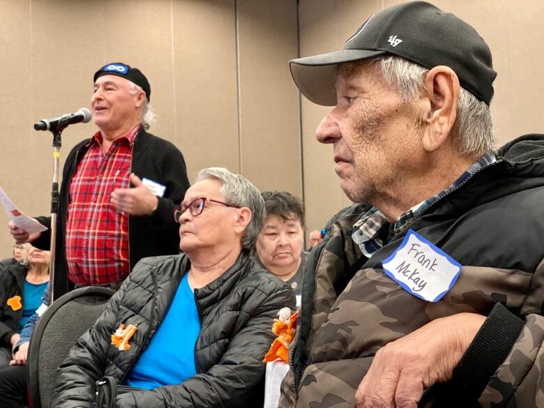 Residential school survivors sit at a gathering in Saskatoon. 