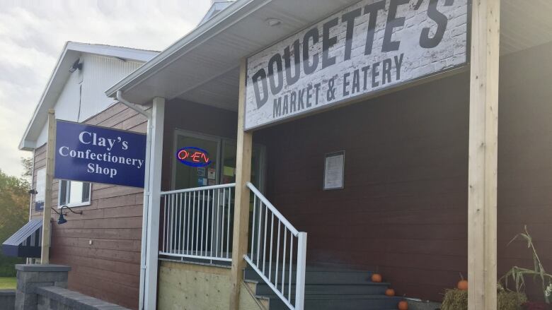 The storefont is shown for Doucette's Market and Eatery in Ingonish Beach, N.S.