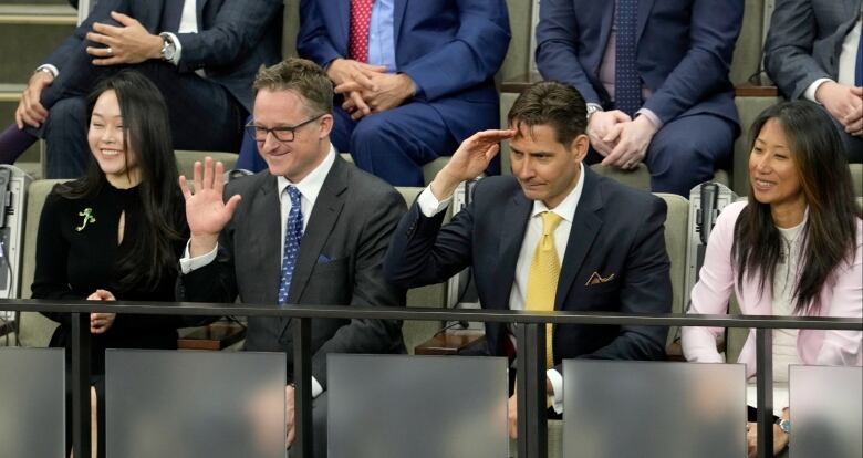 Michael Spavor, centre left, and Michael Kovrig, centre right, receive a standing ovation in the House of Commons.