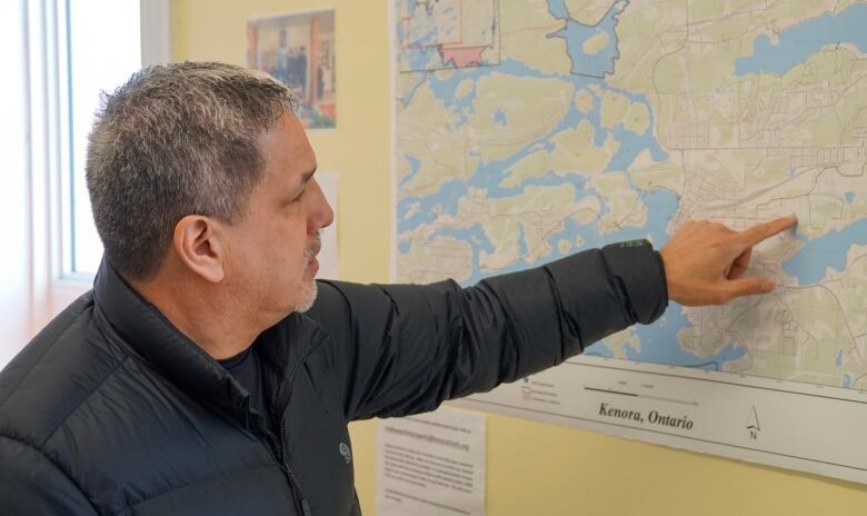 A man pointing at a map.