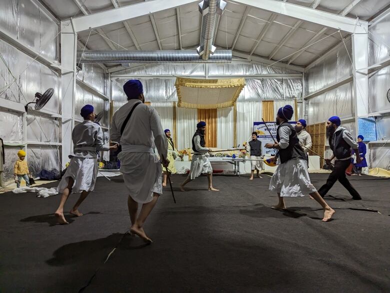 Martial art instructor demonstrates a 7-to-1 defense routine. 