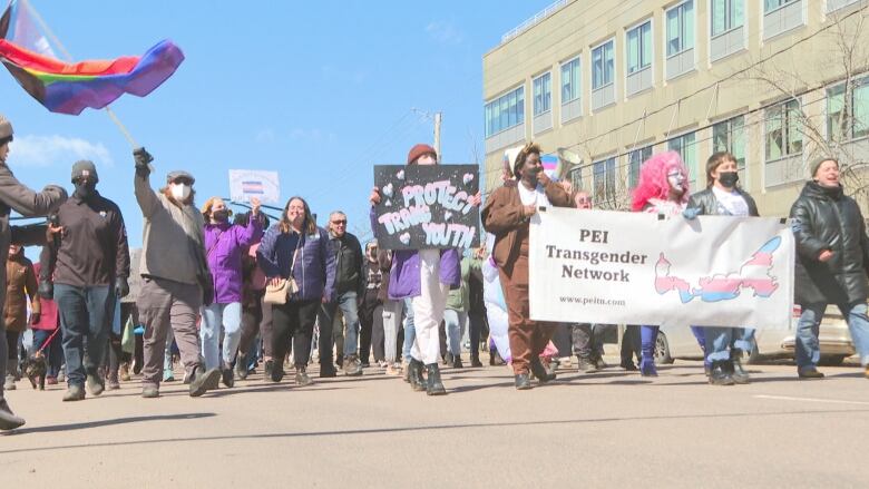 People march along Great George Street in Charlottetown in support of transgender rights.