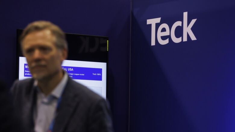 A logo for mining company Teck is shown displayed on a booth at a convention in Toronto.