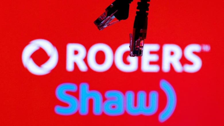 The logos of Rogers and Shaw are shown in front of Local Area Network cabling.