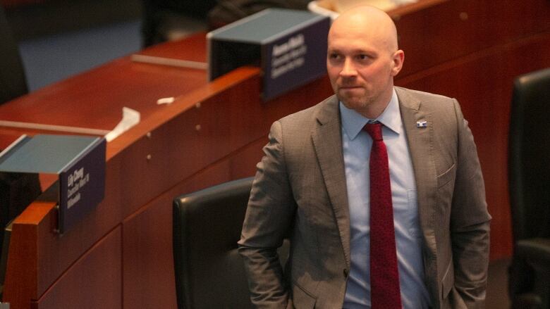 Toronto city councillor Brad Bradford attends a council session in Toronto, Wednesday, March 29, 2023. Bradford has announced that he will run in the forthcoming by-election in Torontos Mayoral race following the resignation of John Tory. THE CANADIAN PRESS/Chris Young