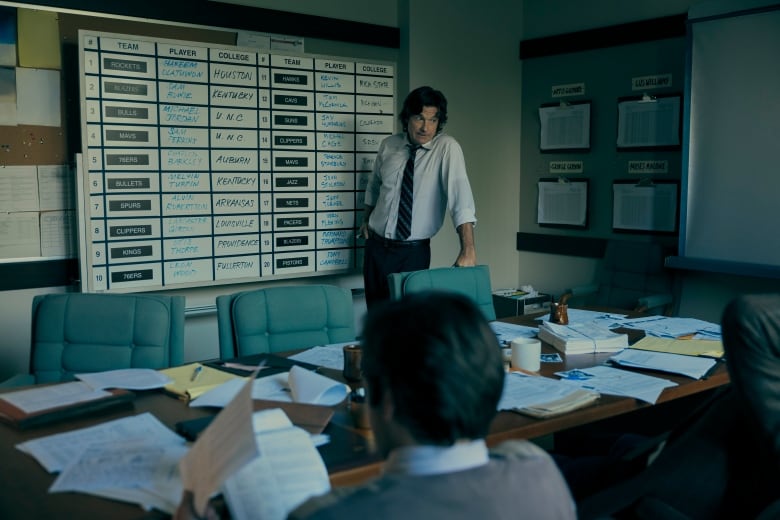 Man in front of White board