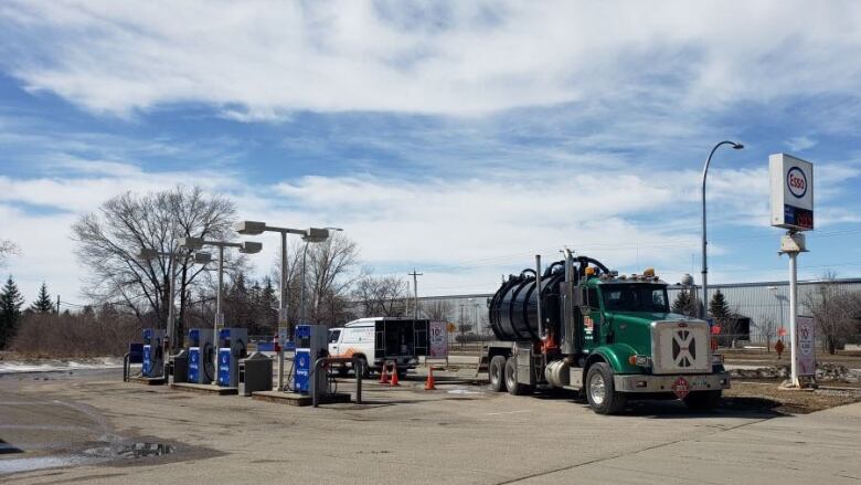 A fuel truck is seen at a gas station.