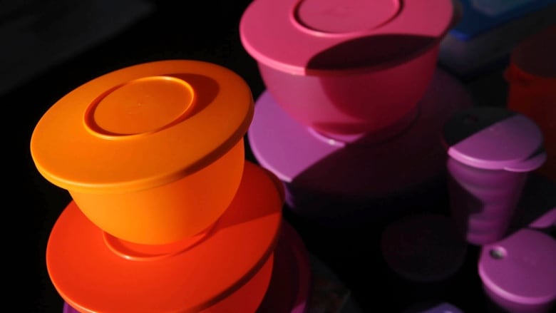 Stacks of colourful tupperware containers.