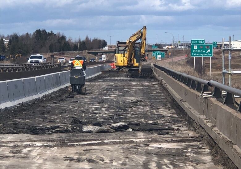 Crew working on a stretch of road.