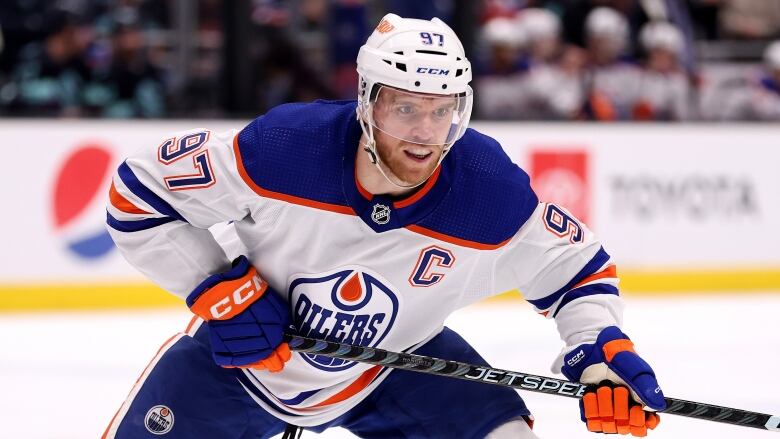 A men's hockey player skates during a game.