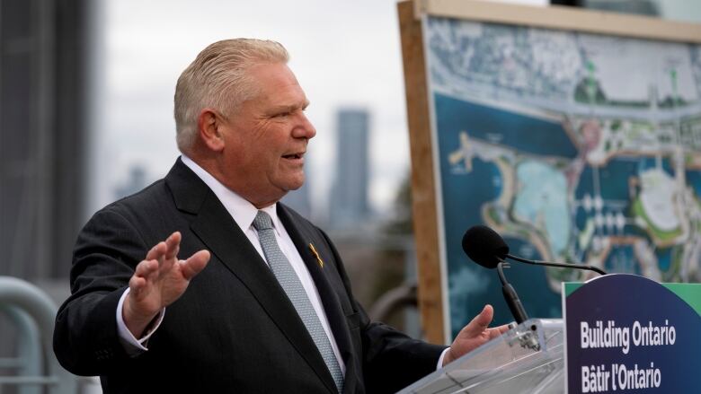 Premier Doug Ford stands at a podium at Ontario Place.