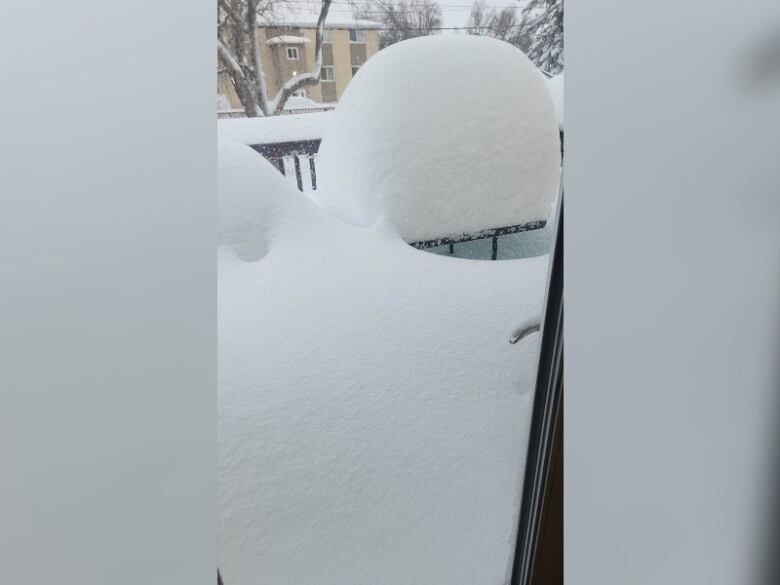 A pile of snow is seen on a table .