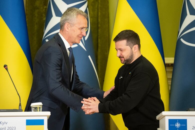 NATO Secretary General Jens Stoltenberg and Ukrainian President Volodymyr Zelenskyy, right, greet each other after a joint press conference in Kyiv, Ukraine on April 20, 2023.