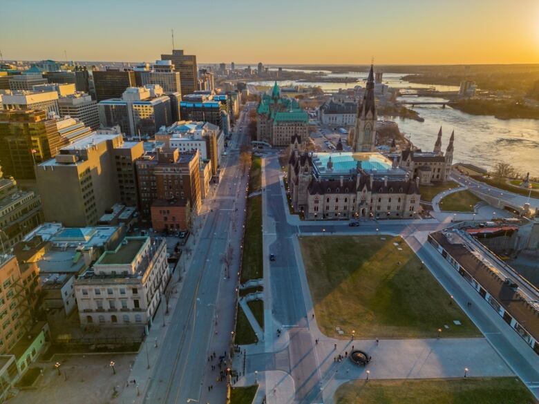 A drone photo of parliamentary and office buildings at sunset.