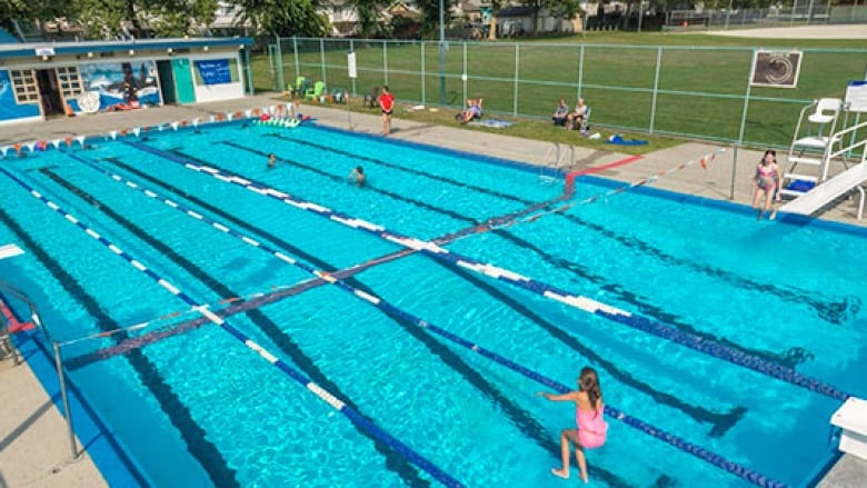 A child prepares to swim in one of several lanes laid out in a public outdoor pool in Port Coquitlam.