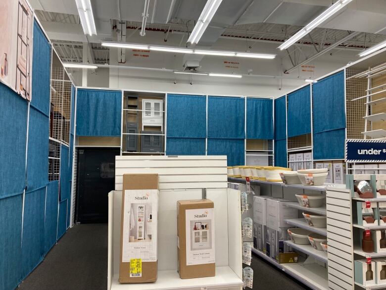 Nearly empty shelves are seen at a store.