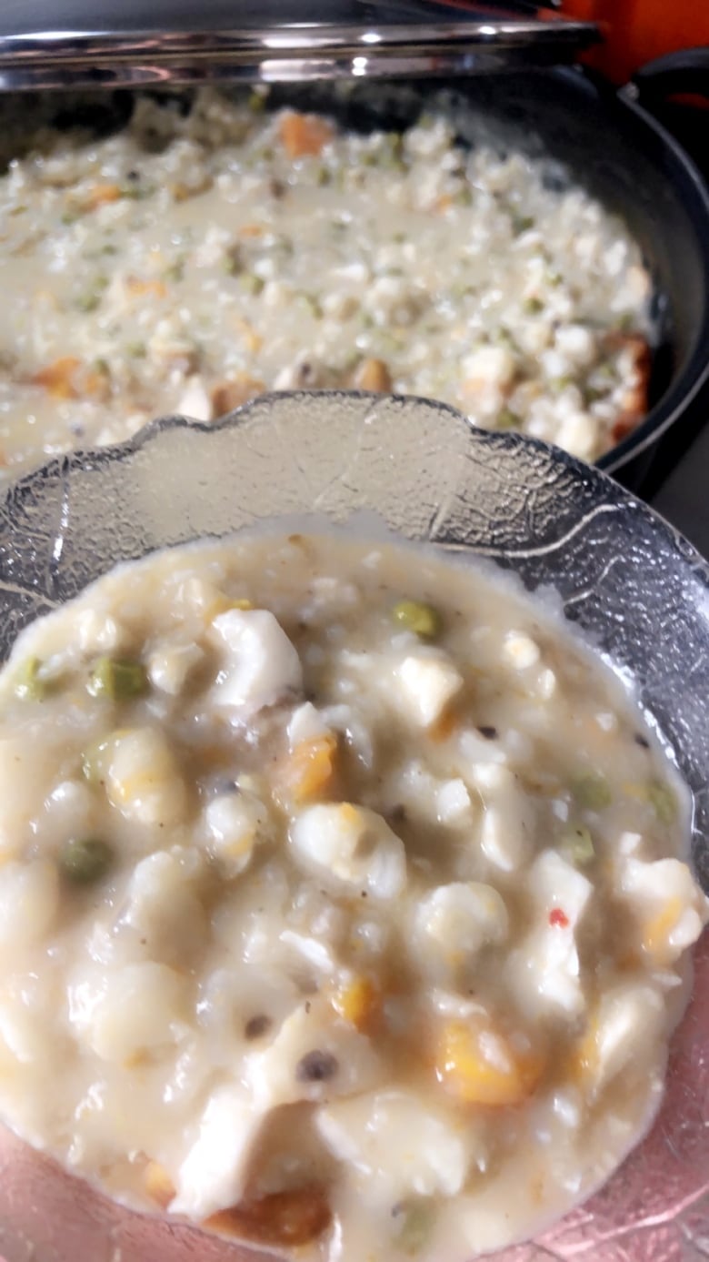 A glass bowl with soup.