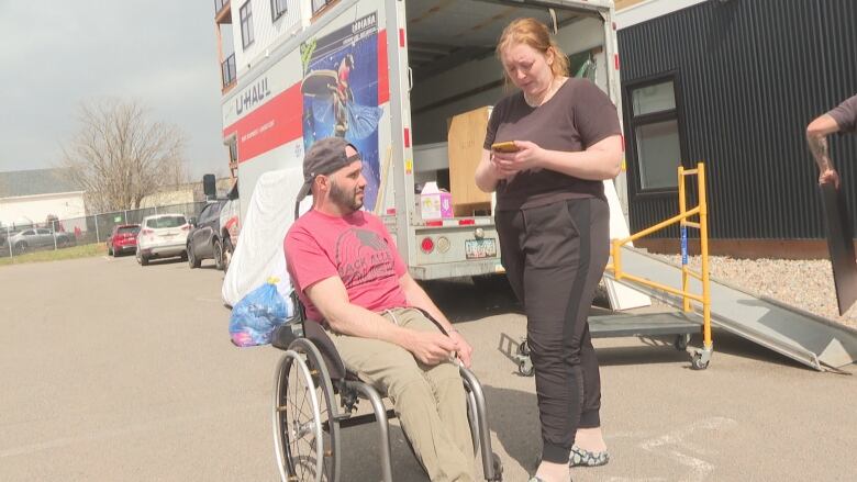 Jeremy MacDonald with his girl friend Sydney Rose, as she moves into his apartment. 