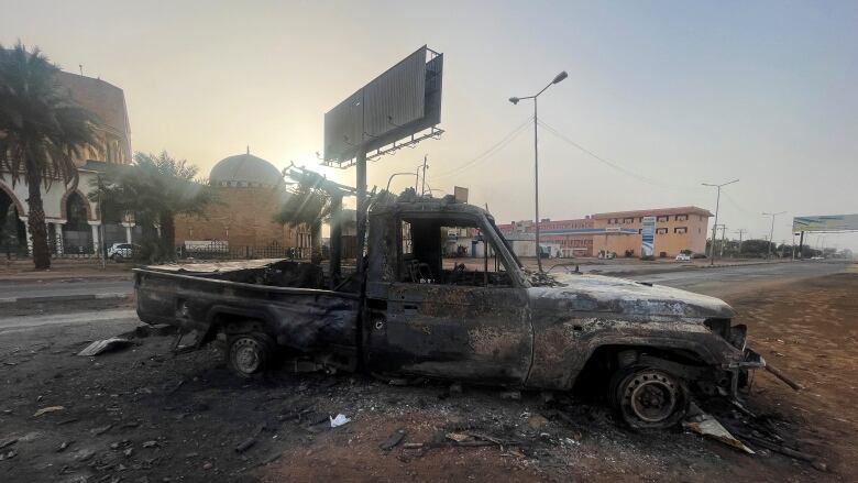 A burned-out vehicle in the Sudanese capital of Khartoum.