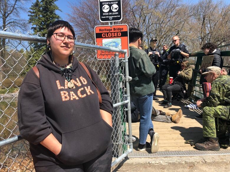 person stands by gate