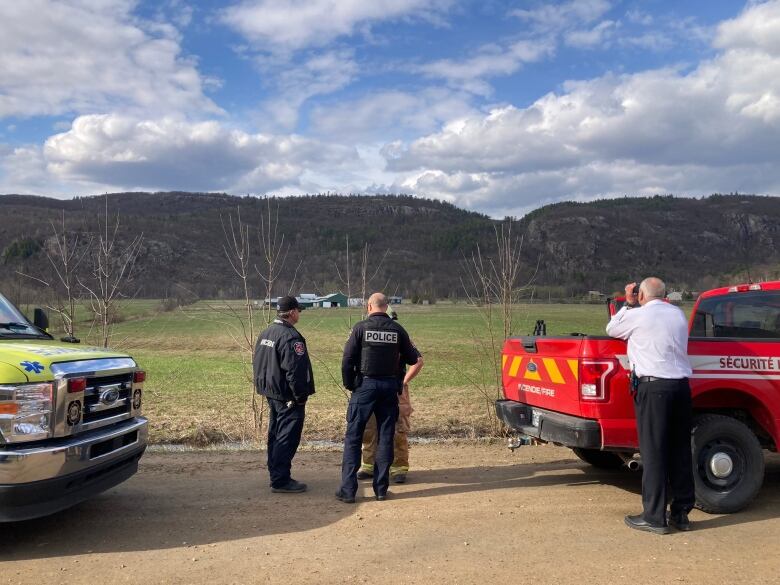 First responders survey the Gatineau hills.