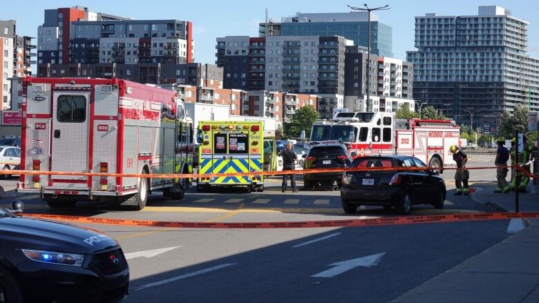 A street with emergency vehicles.