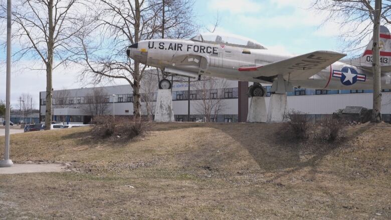 A U.S. Air Force plane is perched on cement pillars. There is no bench in the image, which is a significant detail for the story.