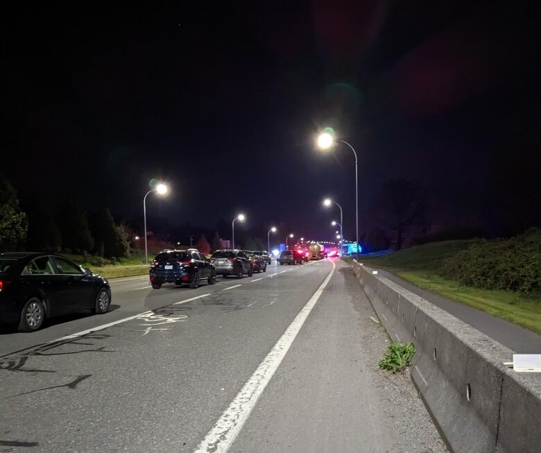 A lineup of cars on a highway.